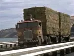 Semi-Truck Hauling hay down a highway