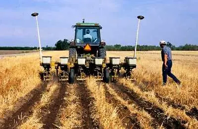 Farmer approaching his farming machinery